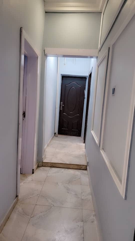 Clean corridor leading to guest rooms