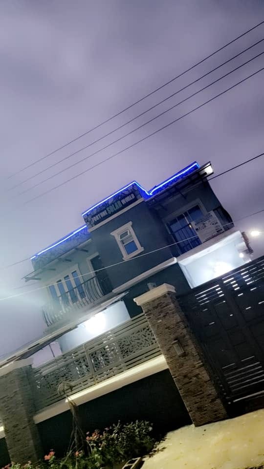 Hotel exterior illuminated with blue roof lighting