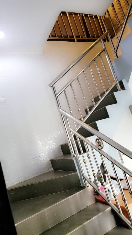 Interior staircase with polished metal railings